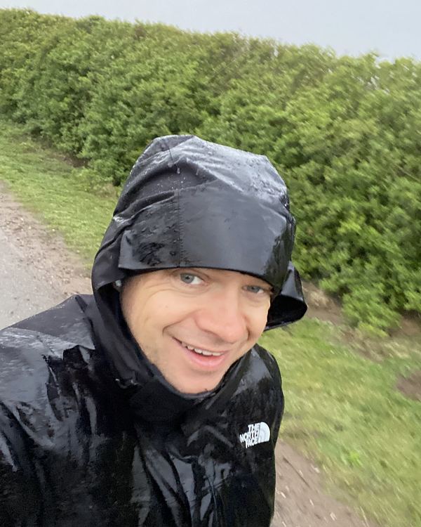 Pete walking in heavy rain